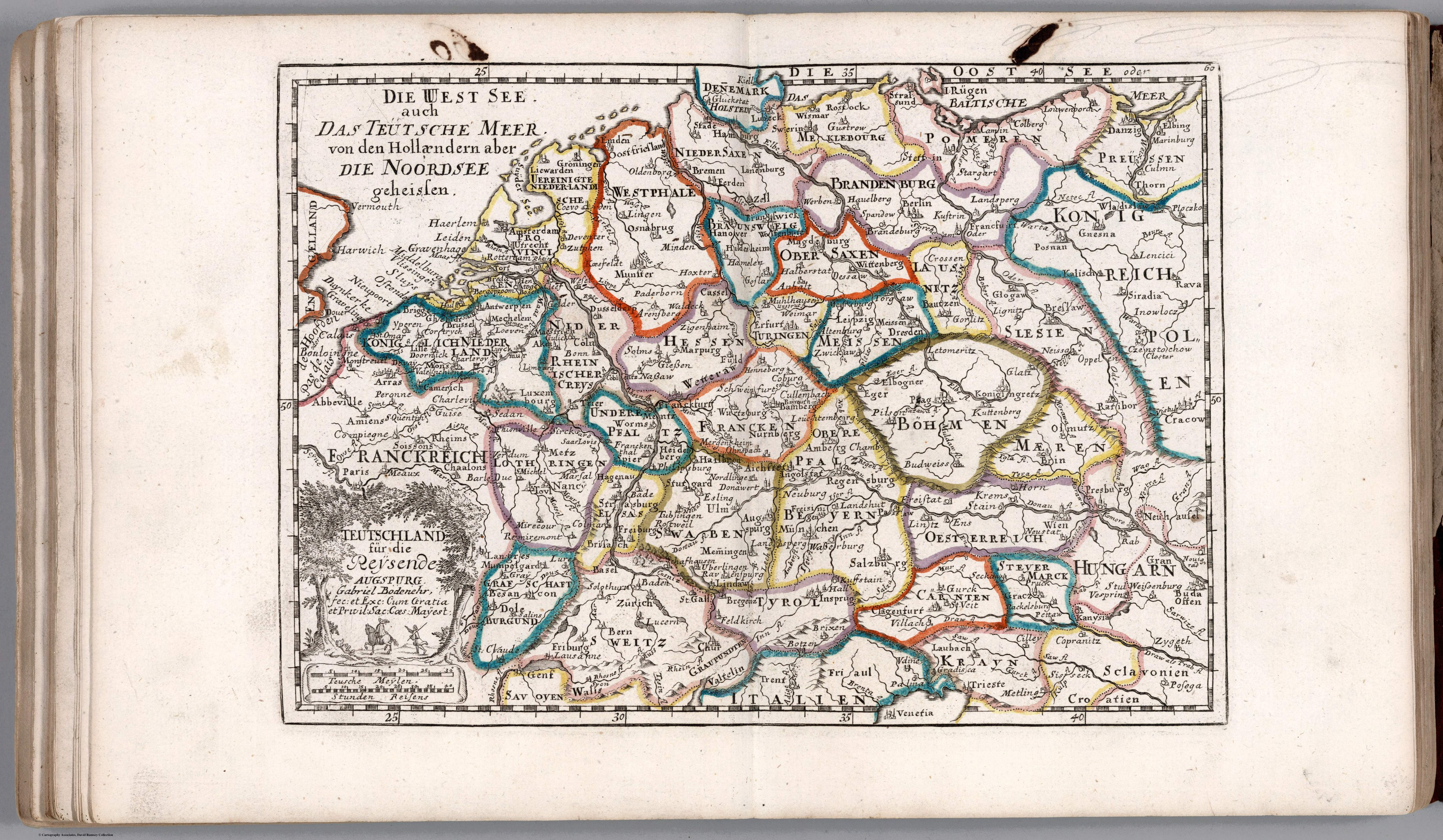 Offenes Buch mit einer detaillierten Karte von Deutschland mit geografischen Merkmalen wie Flüssen, Bergen und Städten, begleitet von beschreibendem Text.