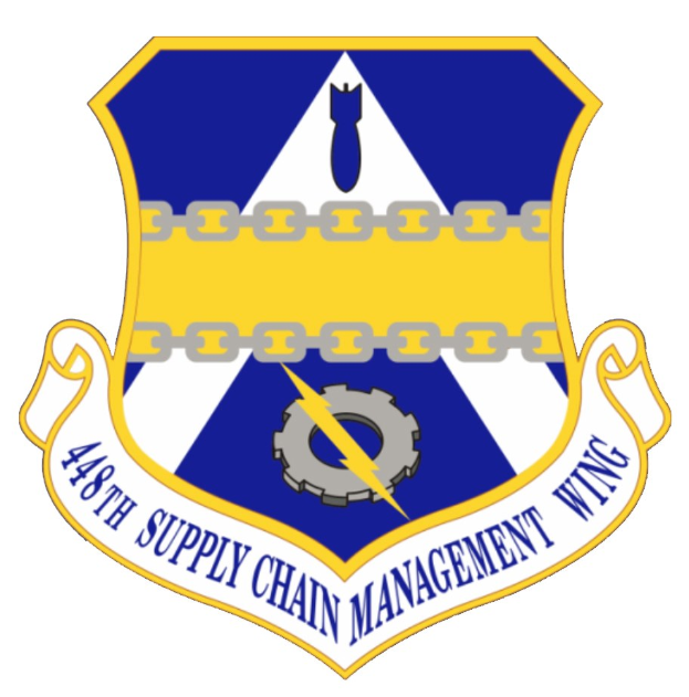Logo der 48. Beschaffungskette mit einem blauen Schild, einem weißen Stern und einem weißen Banner mit der Aufschrift "Beschaffungskette" in blau, alles von einem weißen Rand und schwarzer Schrift umgeben.