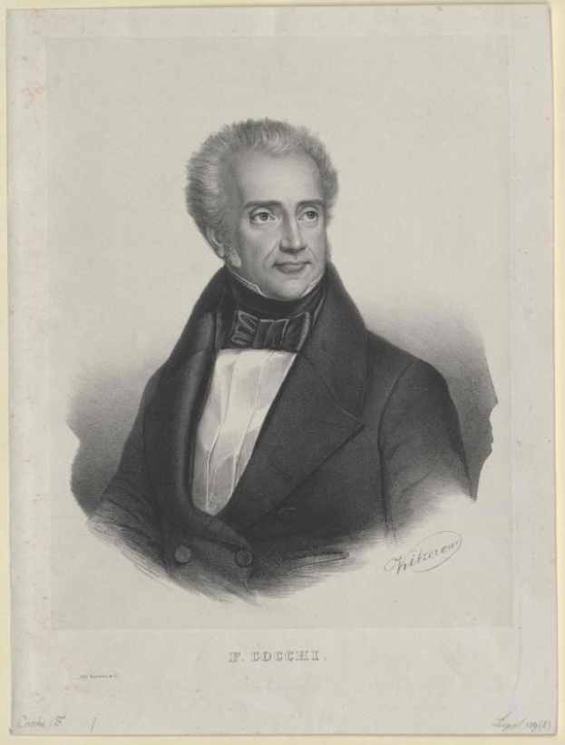 Schwarz-weiß-Porträt des Komponisten F. Cocchi in einem Smoking, mit der Aufschrift "Die Musik der Oper" unten.