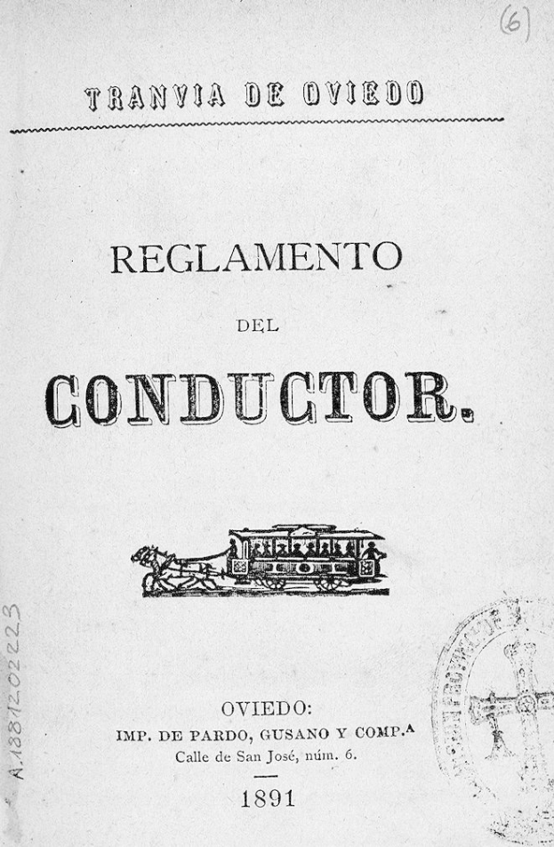 Altes Buch mit dem Titel "Reglamento de Conductor" und einer Zugillustration auf dem Cover und einem Stempel auf der rechten Seite.